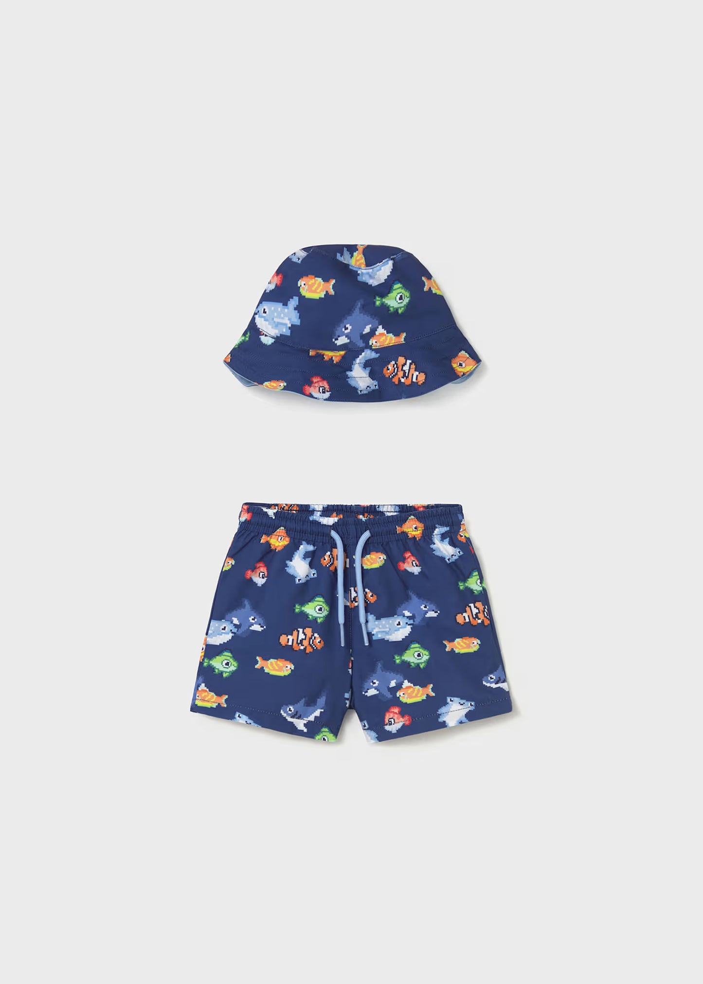 Conjunto traje de baño y gorro reversible protección solar bebé